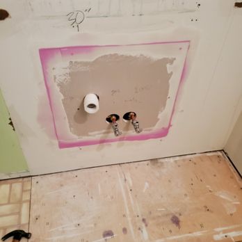Bathroom plumbing and drywall repair